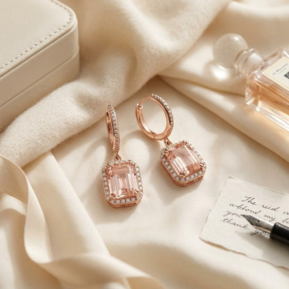 Morganite Emerald Cut with Diamond Pave Halo Earrings in 14k Rose Gold — textile flat lay