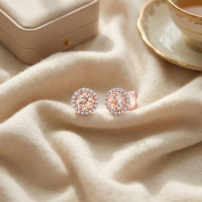 Morganite Round 4 Prong Stud Earrings in 14k Rose Gold — textile flat lay
