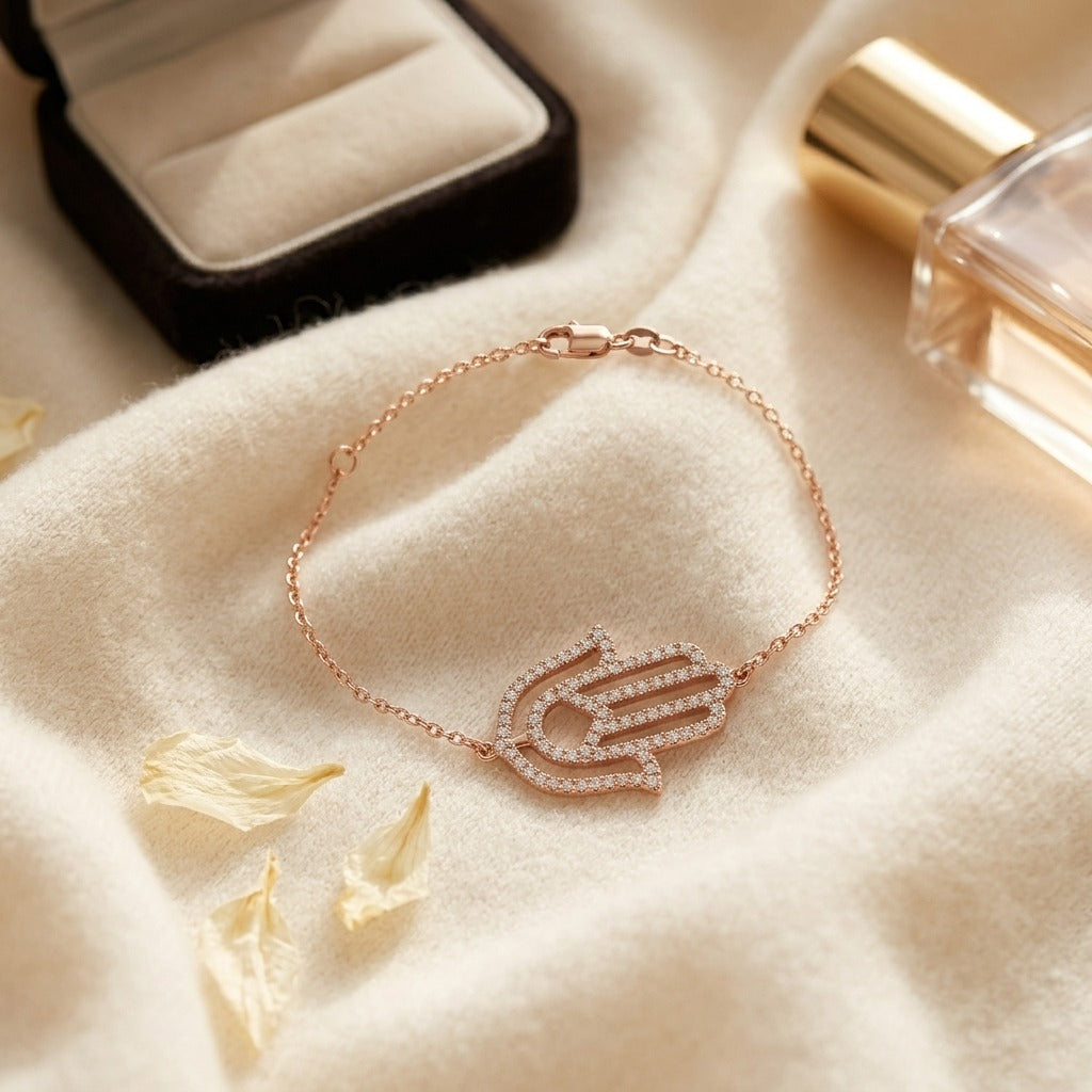Hamsa Diamond Pave Bracelet in 14k Rose Gold (2/3 Ct.tw.) — textile flat lay