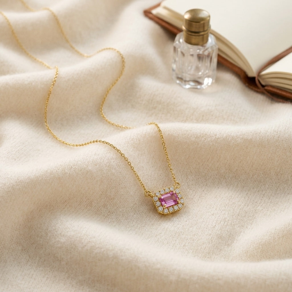 Sapphire and 1/16ctw Diamond Necklace 18in Chain 14k Rose Gold — textile flat lay