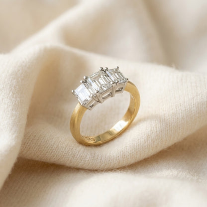 3 Stone Emerald Cut Band In 14k Two Tone Gold (1 1/2 Ct. Tw.) — textile flat lay