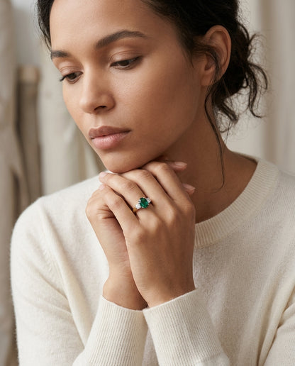 Created Emerald And Diamond Oval 3 Stone Ring In 14k Two Tone Gold — editorial close-up