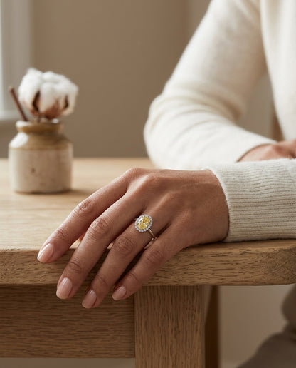 Fancy Light Yellow Diamond Oval Halo Ring In 14k Two Tone Gold — editorial close-up