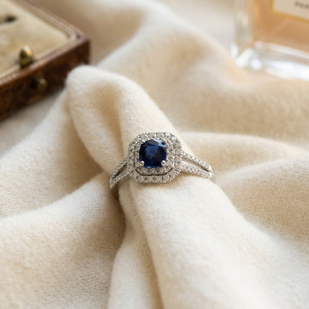 Sapphire and Diamond Double Halo Engagement Ring in 14k White Gold — textile flat lay