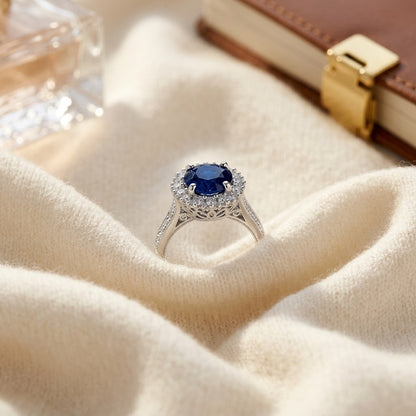 Sapphire And Diamond Prong Halo Ring In 14k White Gold — textile flat lay