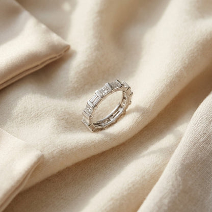 Diamond Channel Eternity Band in 14k White Gold — textile flat lay