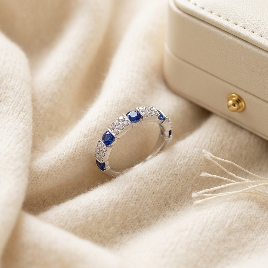 Round Sapphire And Diamond Ring In 14k White Gold — textile flat lay