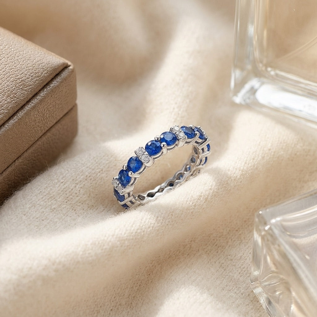 Sapphire and Diamond Single Row Prong-Set Band in 14k White Gold — textile flat lay