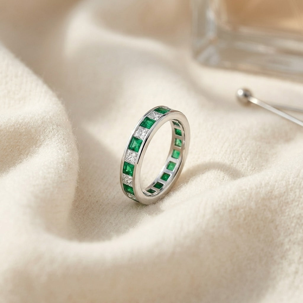 Emerald & Diamond Princess Cut Eternity Band in 14k White Gold — textile flat lay