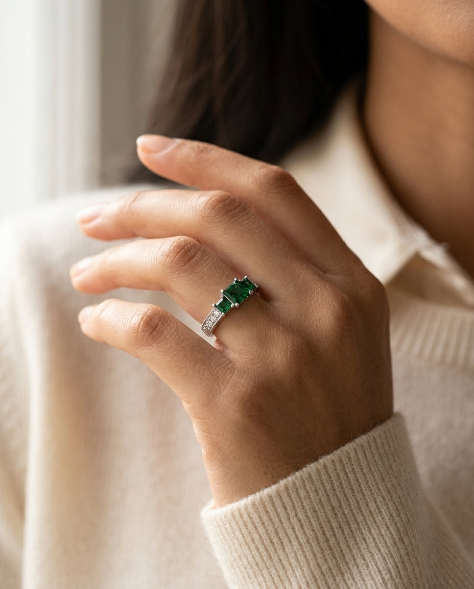 Created Emerald And Diamond 3 Stone Filigree Ring In 14k White Gold — editorial close-up
