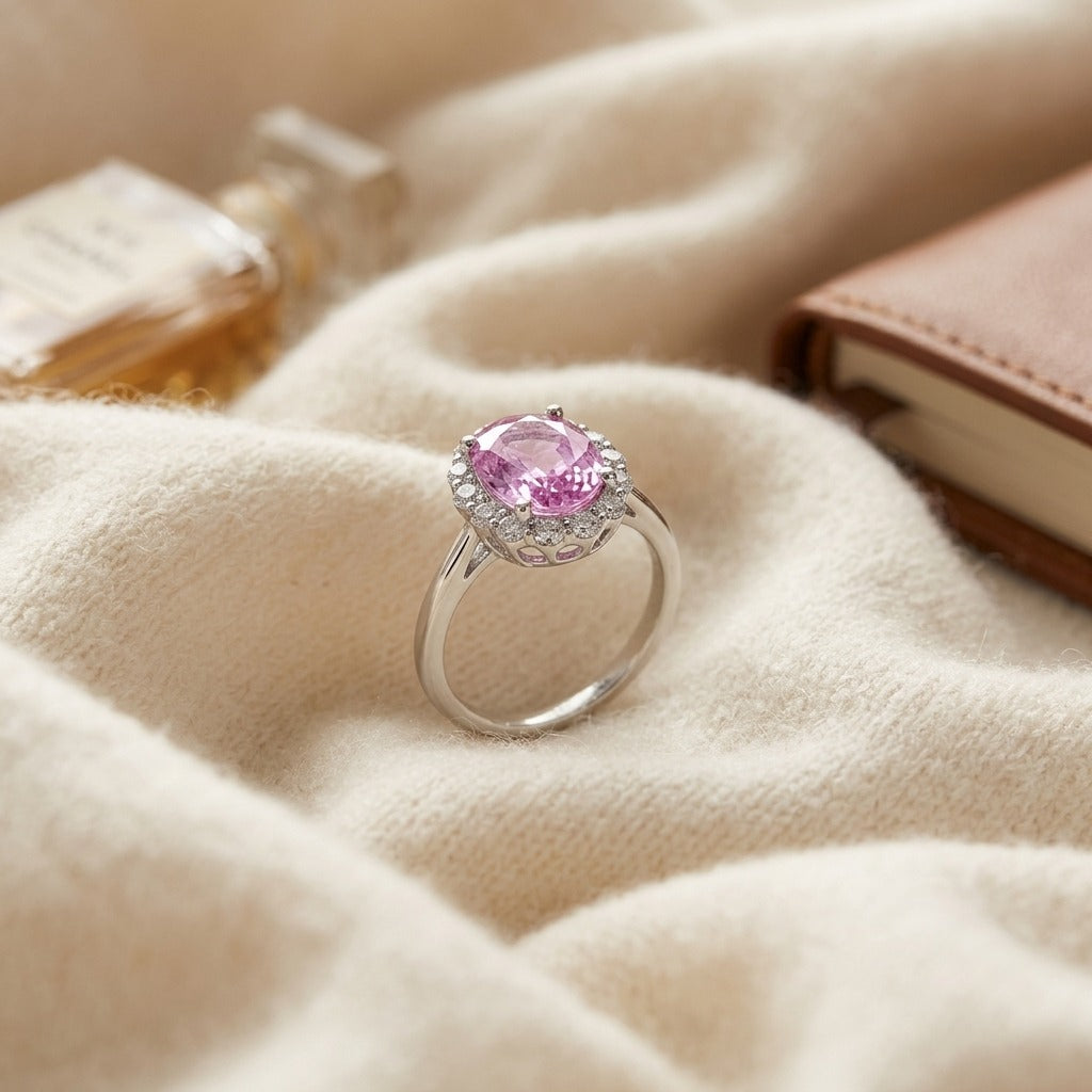 Oval Pink Sapphire And Diamond Halo Ring In 14k White Gold — textile flat lay
