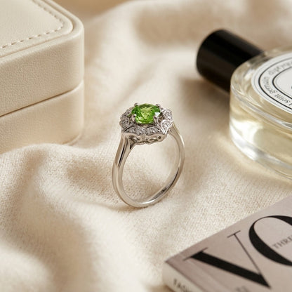 Peridot and Diamond Flower Ring in 14k White Gold — textile flat lay