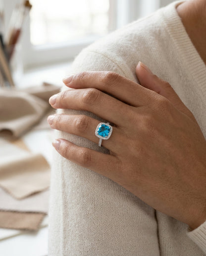 Swiss Blue Topaz Cushion And Diamond Halo Ring In 14k White Gold (1/5 Ct. Tw.) — editorial close-up
