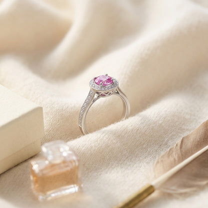 Pink Sapphire and Diamond Halo Ring in 14k White Gold — textile flat lay