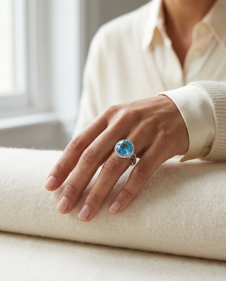 Blue Topaz And Diamond Halo Ring In 14k White Gold — editorial close-up