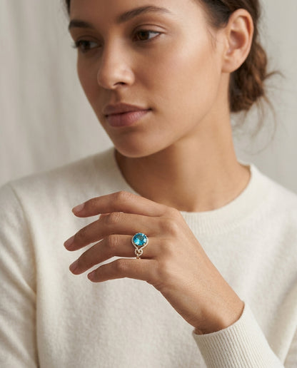 Swiss Blue Topaz And Diamond Double Knot Twist Ring In 14k Yellow Gold — editorial close-up