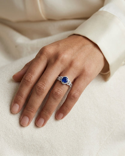 Round Blue Sapphire And Diamond Twisted Halo Ring In 14k White Gold ( Hi/si) (6.5mm) — editorial close-up