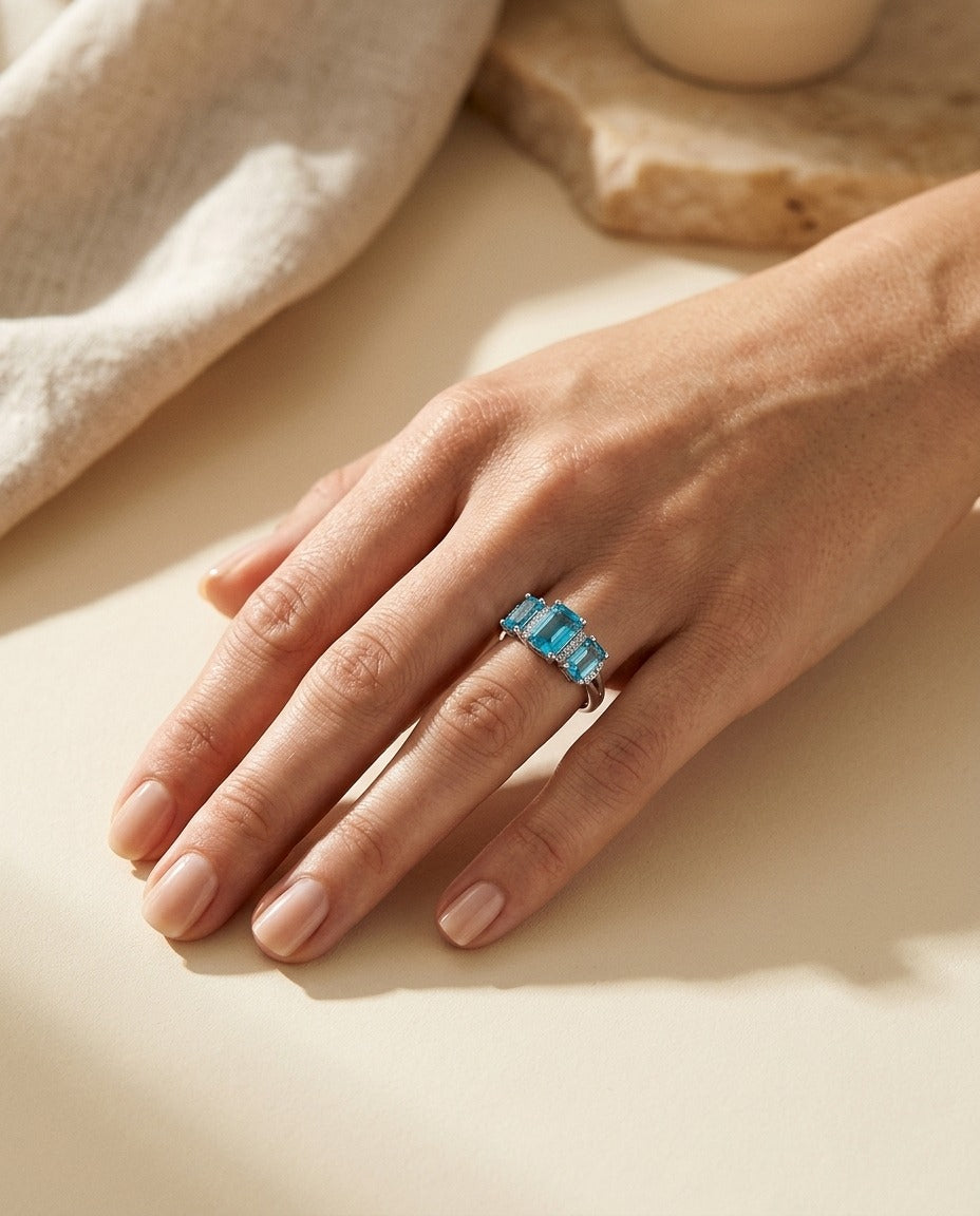 Blue Topaz and Diamond 3 Stone Emerald Cut Ring in 14k White Gold 0.12ctw Hi/Si — portrait close