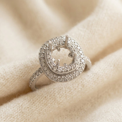 Peridot and Diamond Double Halo Ring in 14k White Gold — textile flat lay