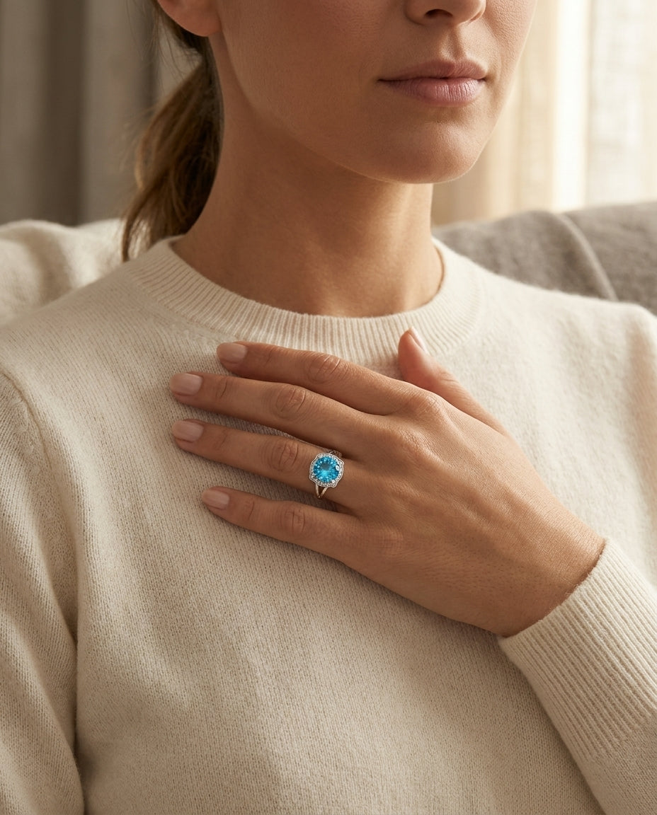 Blue Topaz And Diamond Round Halo Pinched Corner Ring In 14k White Gold — editorial close-up