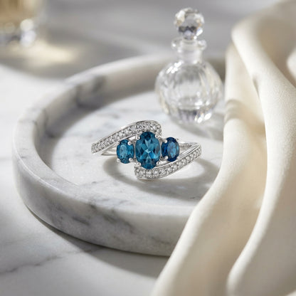 London Blue Topaz Three Stone Swirl Ring in 14k White Gold 1/8ctw — atelier still life