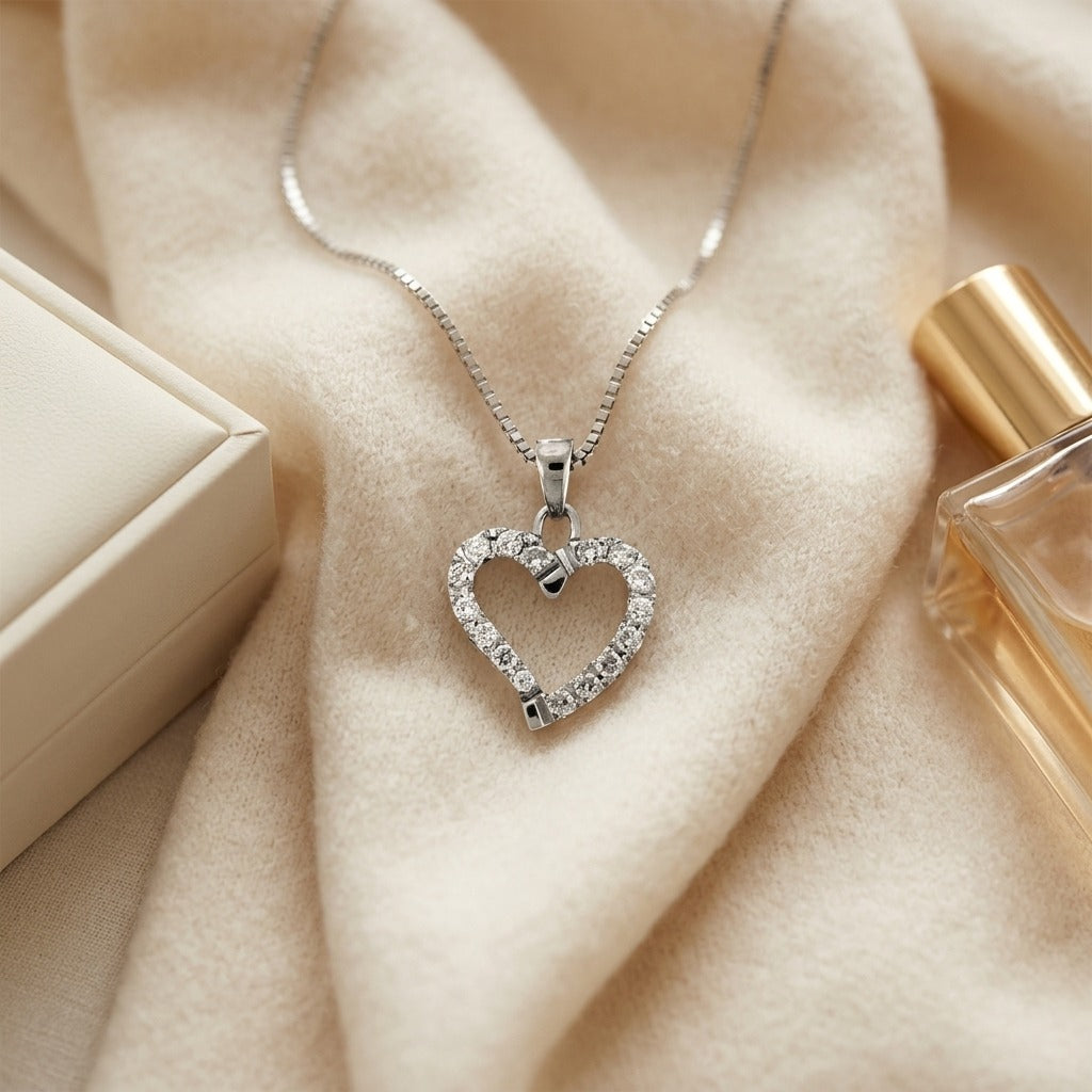 Diamond Dangle Heart Pendant In 14k White Gold — textile flat lay