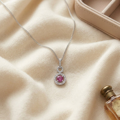 Pink Sapphire and Diamond Doorknocker Pendant in 14k White Gold (5mm Round Center) — textile flat lay