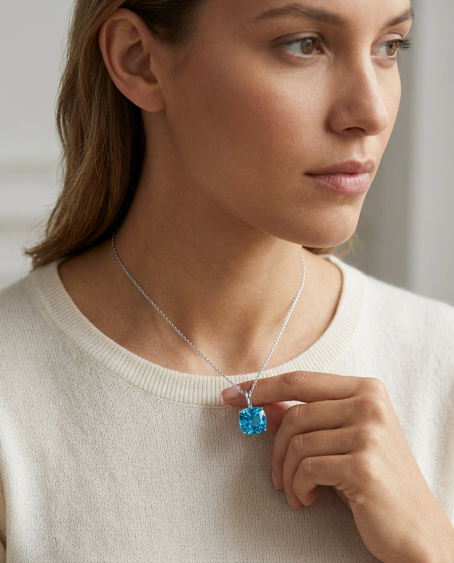 Blue Topaz Solitaire Pendant In 14k White Gold — editorial close-up