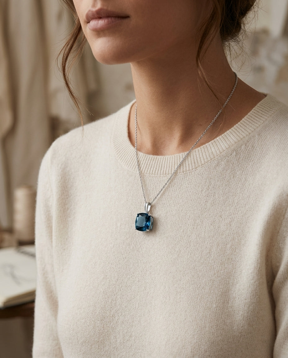 Blue Topaz Pendant In 14k White Gold — editorial close-up