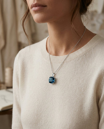Blue Topaz Pendant In 14k White Gold — editorial close-up