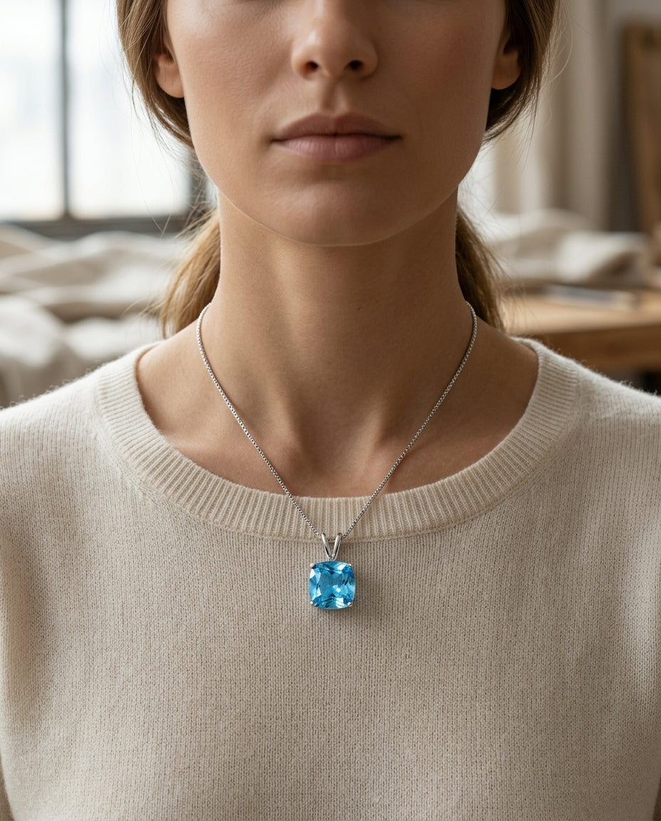 Blue Topaz Cushion Pendant In 14k White Gold — editorial close-up