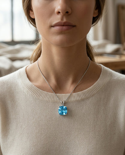 Blue Topaz Cushion Pendant In 14k White Gold — editorial close-up