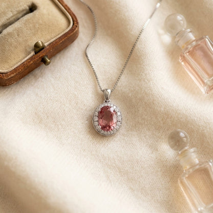 Pink Tourmaline And Diamond Oval Halo Pendant In 14k White Gold — textile flat lay