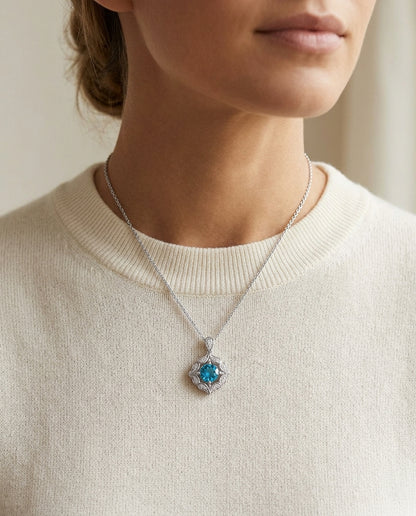 Blue Topaz And Diamond Floral Pendant In 14k White Gold — editorial close-up