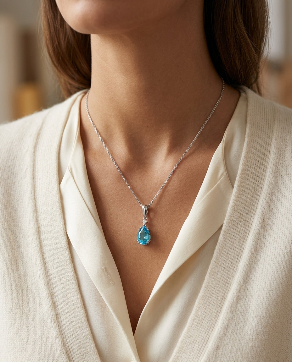 Blue Topaz And Diamond Pendant In 14k White Gold — editorial close-up