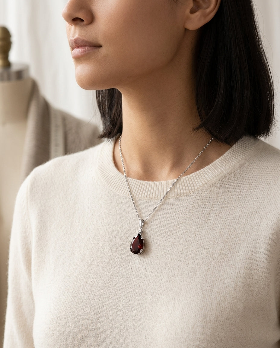 Garnet And Diamond Pendant In 14k White Gold On 18" Baby Curb Chain — editorial close-up