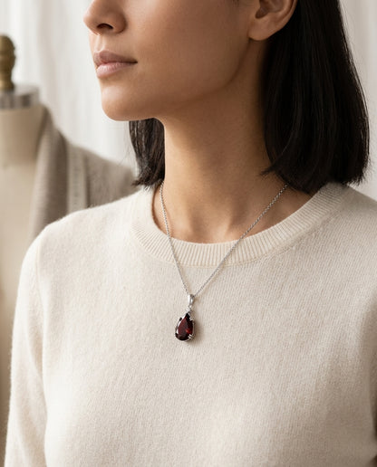 Garnet And Diamond Pendant In 14k White Gold On 18" Baby Curb Chain — editorial close-up