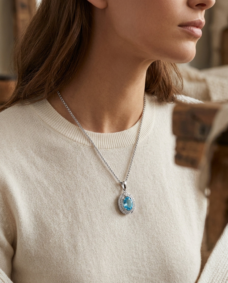 Oval Swiss Blue Topaz & Diamond Pendant In 14k White Gold — editorial close-up