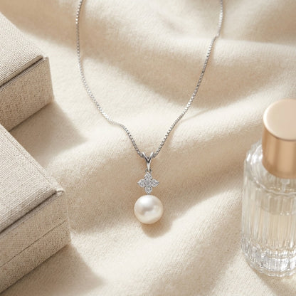 Akoya Pearl And Diamond Pendant In 14k White Gold 1/7ctw — textile flat lay
