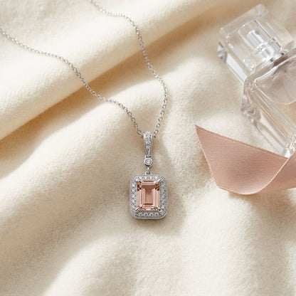 Morganite and Diamond Emerald Cut Halo Dangle Pendant in 14k White Gold (8x6mm Center) — textile flat lay