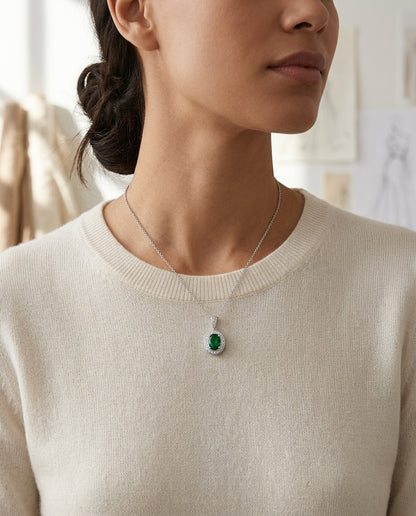 Created Emerald And Diamond Oval Halo Dangle Pendant In 14k White Gold 18-in Chain — editorial close-up