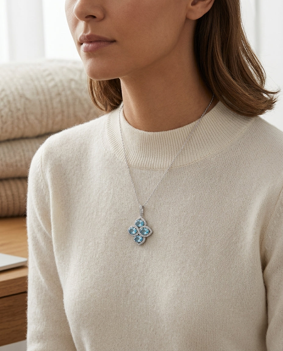 Blue Topaz And Diamond Oval Cluster Flower Pendant In 14k White Gold (6x4mm) — editorial close-up