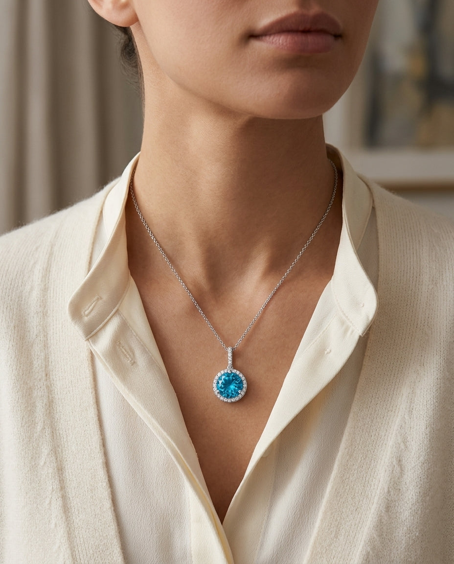 Blue Topaz And Diamond Martini-set Round Halo Pendant In 14k White Gold — editorial close-up