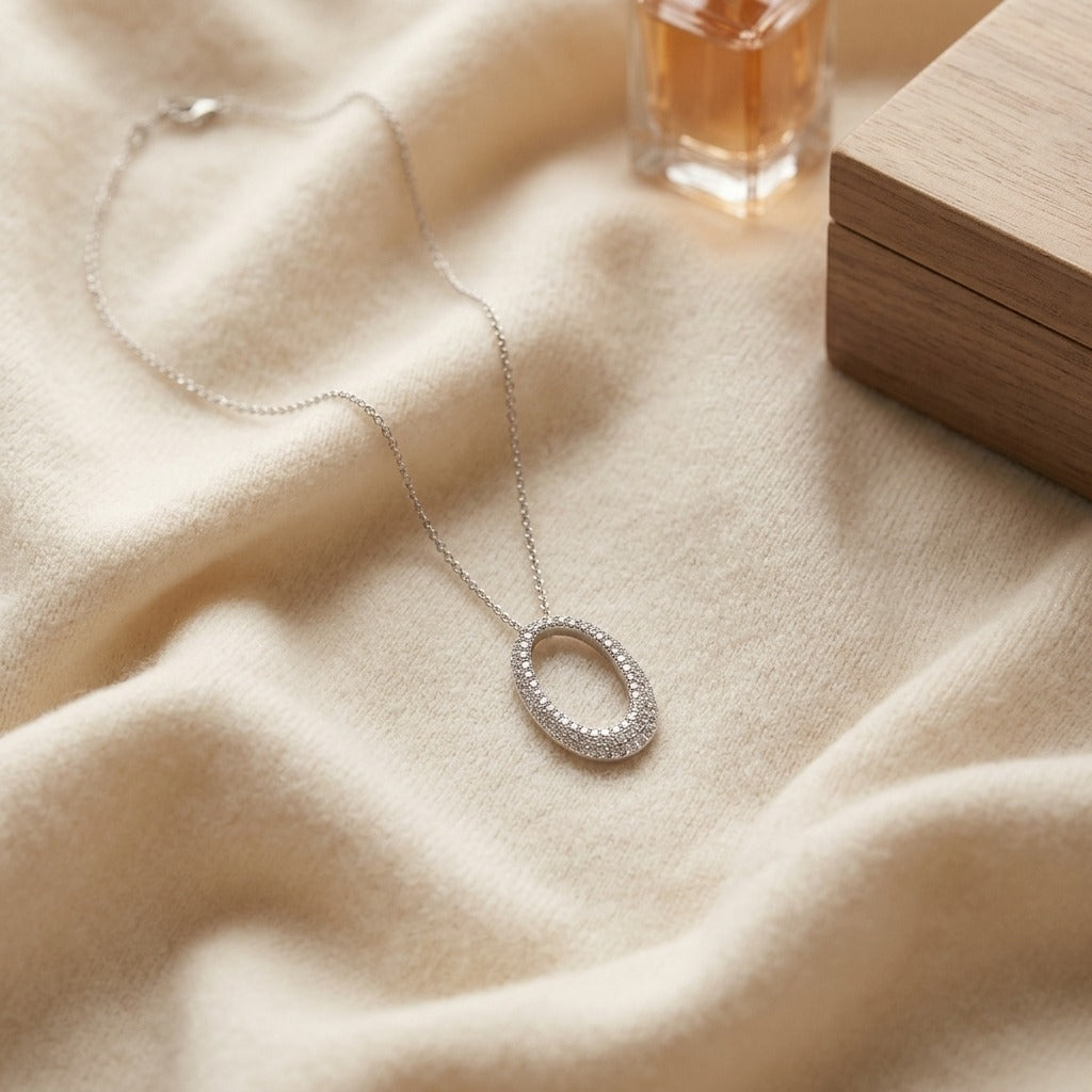 Diamond Pave Oval Pendant In 14k White Gold 3/8ctw — textile flat lay
