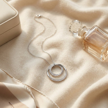 Diamond Double Loop Circle Pendant In 14k White Gold 1/2ctw — textile flat lay