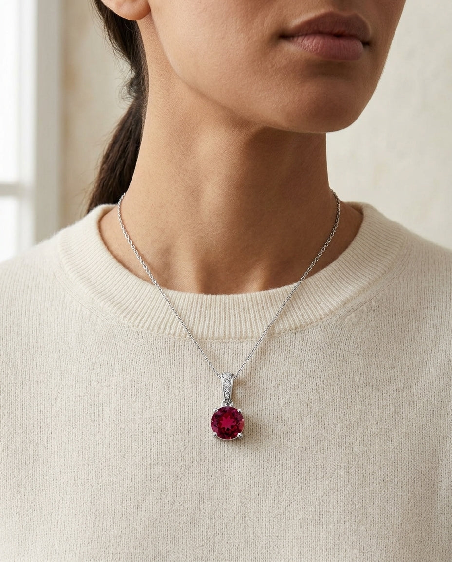 Ruby Round Solitaire Pendant With Diamond Bail In 14k White Gold (18-in Curb Chain) — editorial close-up