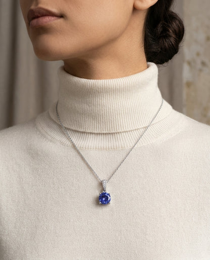 Tanzanite And Diamond Pendant In 14k White Gold — editorial close-up
