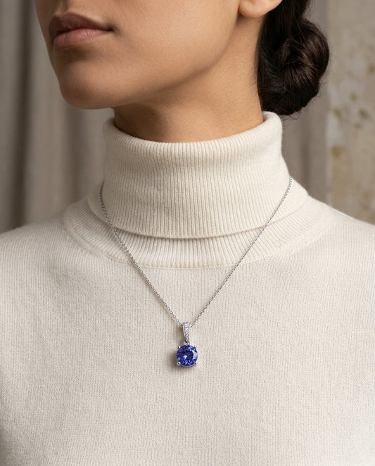Tanzanite And Diamond Pendant In 14k White Gold — editorial close-up