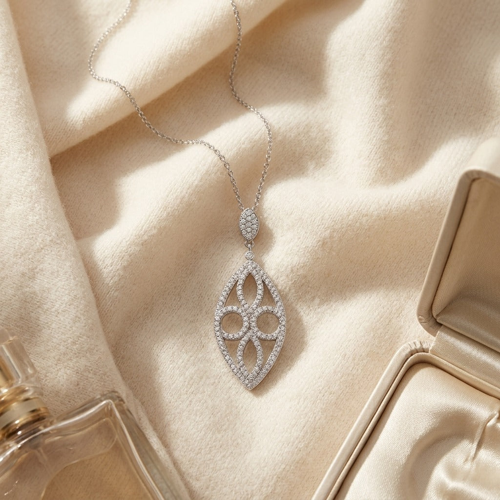 Marquise Shaped Diamond Pave Pendant In 14k White Gold — textile flat lay