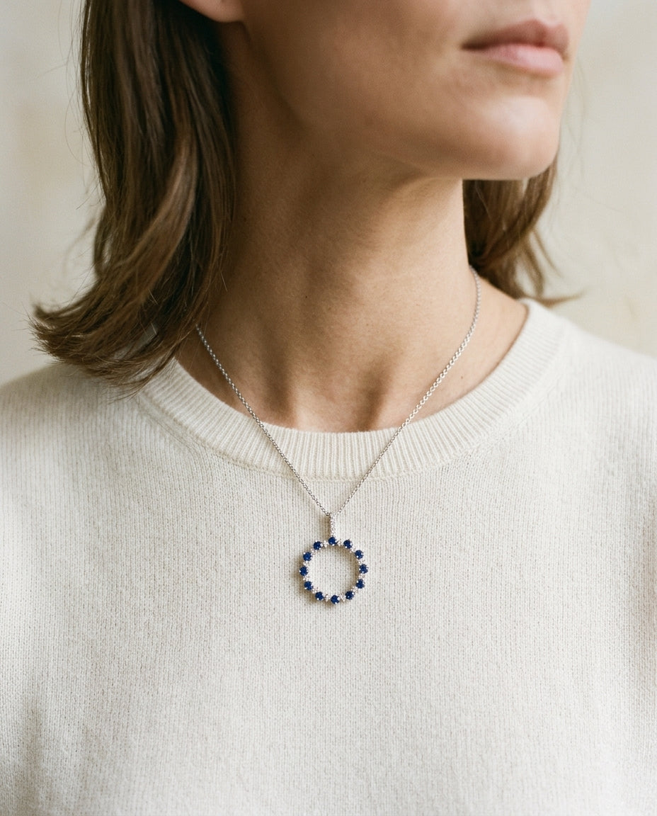 Sapphire And Diamond Prong Circle Pendant With Diamond Bale In 14k White Gold (18-in Curb Chain) — editorial close-up